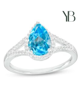 Anillo de espiga dividida con Topacio azul suizo en forma de pera y marco de Zafiro blanco en plata